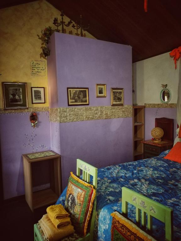 Posteľ alebo postele v izbe v ubytovaní Art B&B La Casa del Pittore