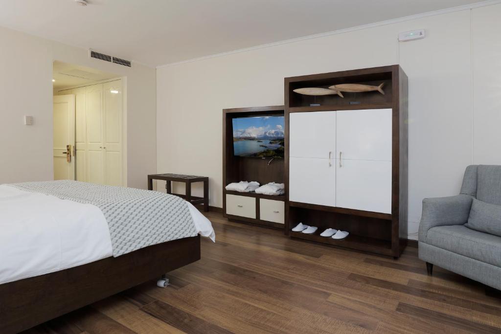 Postel nebo postele na pokoji v ubytování MR Hotel Providencia (ex Hotel Neruda)