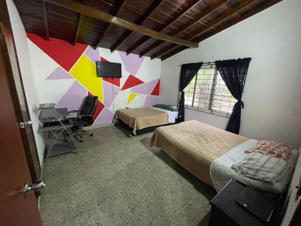 Postel nebo postele na pokoji v ubytování Hostel Urban City Medellin