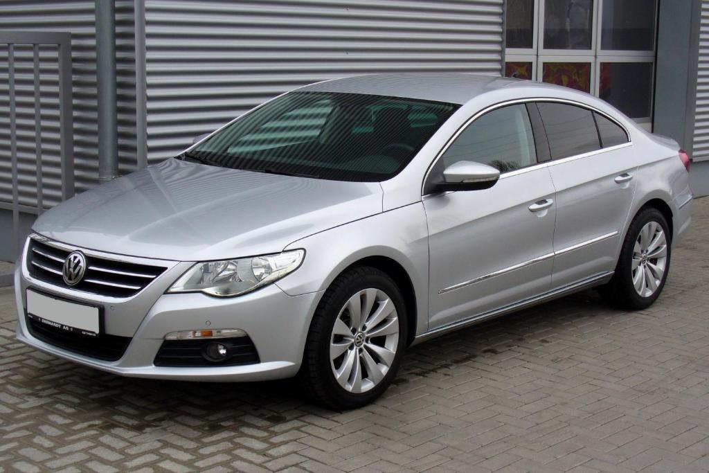 a silver car parked in front of a building at Albanian Car Hire in Rinas
