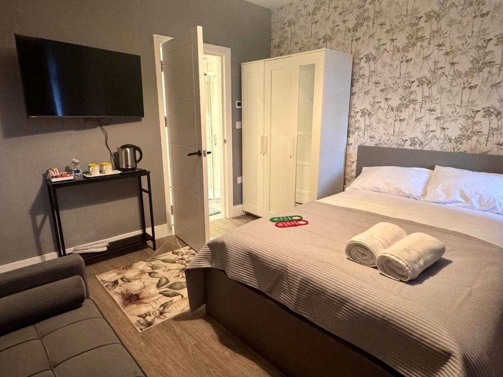 Postel nebo postele na pokoji v ubytování 40th Avenue Guest House