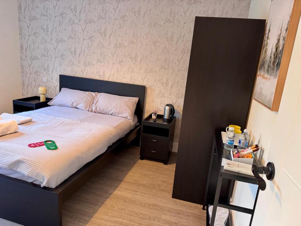 Postel nebo postele na pokoji v ubytování 40th Avenue Guest House