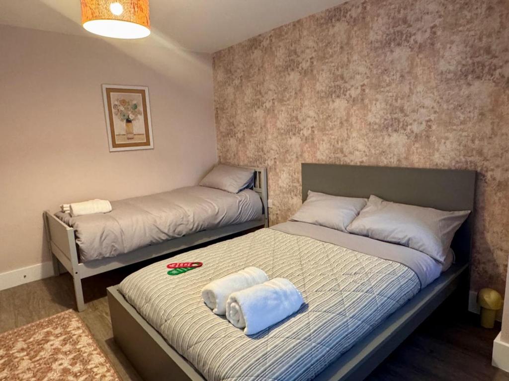 Postel nebo postele na pokoji v ubytování 40th Avenue Guest House
