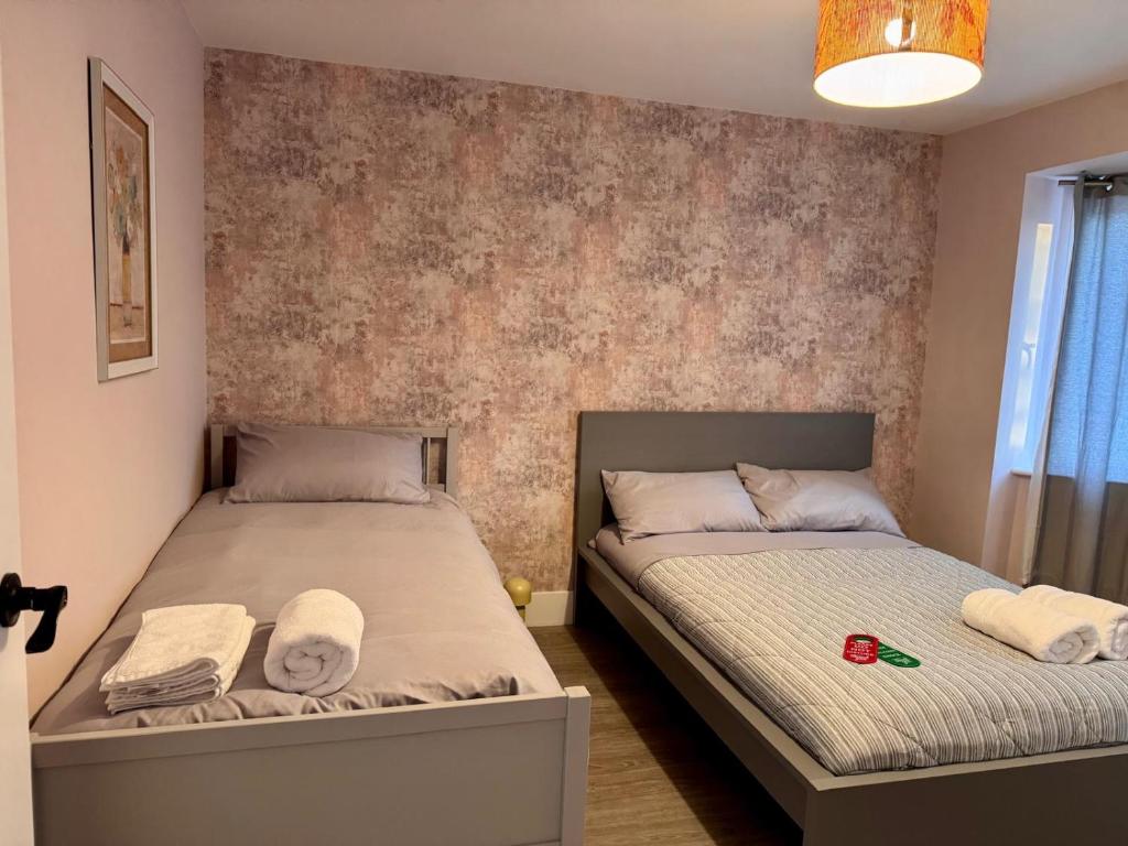 Postel nebo postele na pokoji v ubytování 40th Avenue Guest House