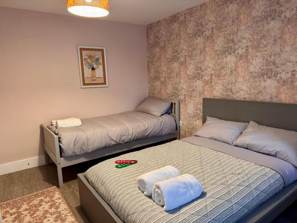 Postel nebo postele na pokoji v ubytování 40th Avenue Guest House