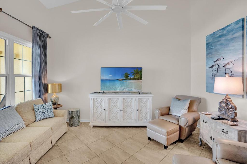 a living room with a couch and a tv at 305 West in Gulf Highlands