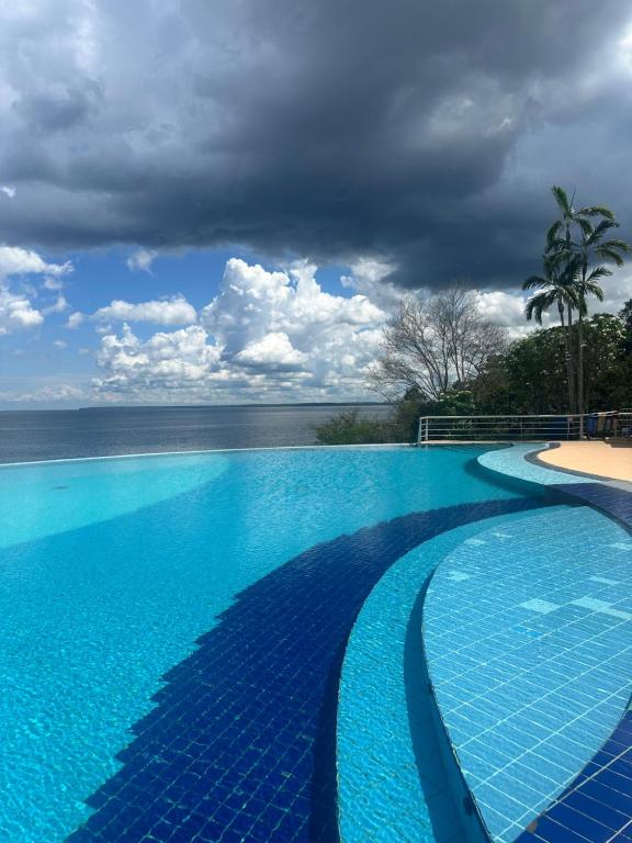 Bazén v ubytování Flat Tropical nebo v jeho okolí