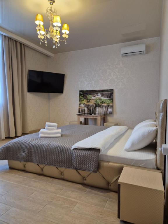 Postel nebo postele na pokoji v ubytování Viktoriya Family 2 Country complex