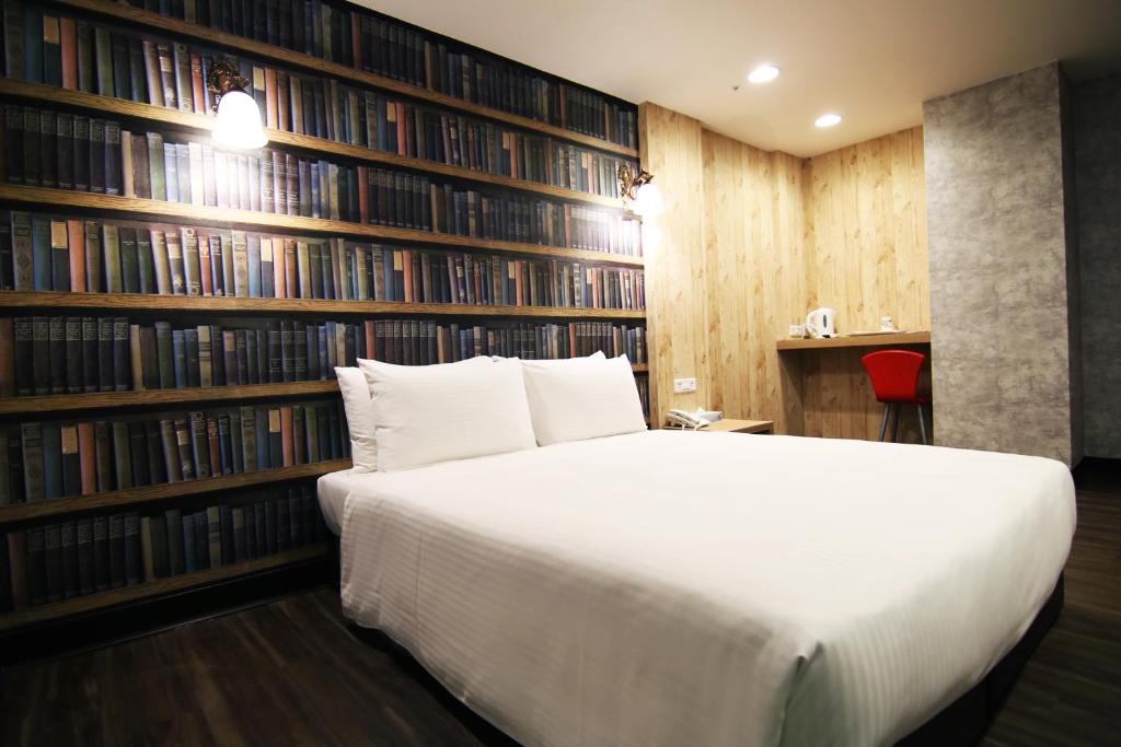 Postel nebo postele na pokoji v ubytování LIHO Hotel Hankou