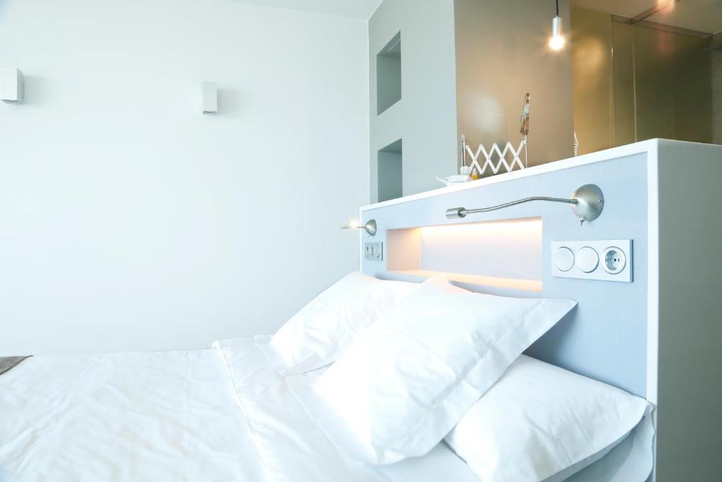 Postel nebo postele na pokoji v ubytování Hotel Flamero