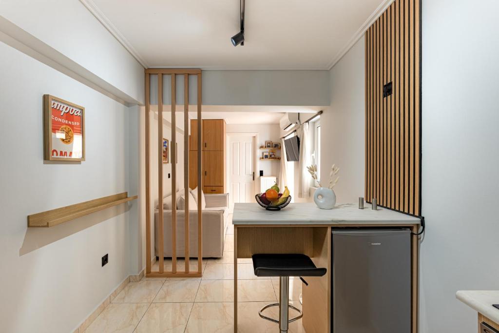 a kitchen with white walls and a counter top at Atherial Studio in Athens