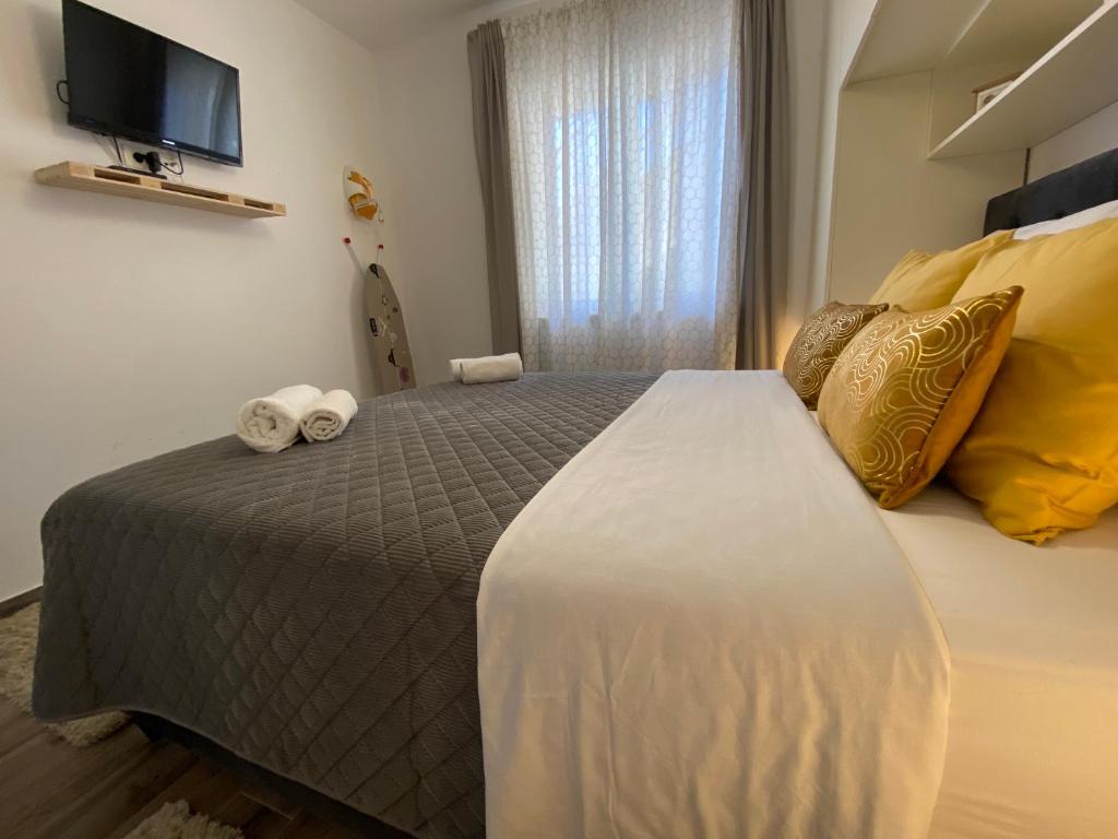 Posteľ alebo postele v izbe v ubytovaní Villa Pergola-Apartment Toni