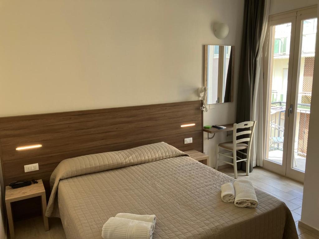 Postel nebo postele na pokoji v ubytování Hotel Bed and Book