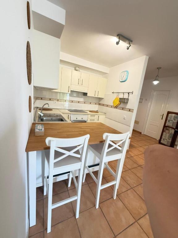 Kuchyň nebo kuchyňský kout v ubytování Corralejo Suite