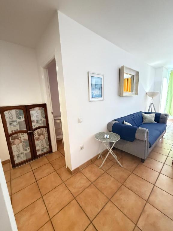Postel nebo postele na pokoji v ubytování Corralejo Suite