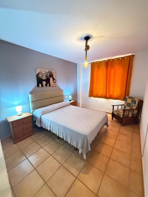 Postel nebo postele na pokoji v ubytování Corralejo Suite