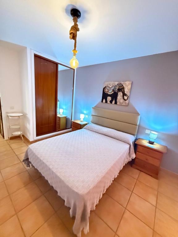 Postel nebo postele na pokoji v ubytování Corralejo Suite