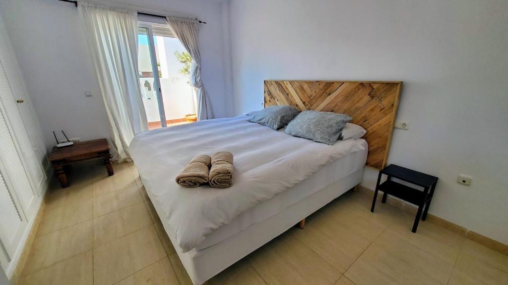 En eller flere senge i et værelse på Casa Indi Vera