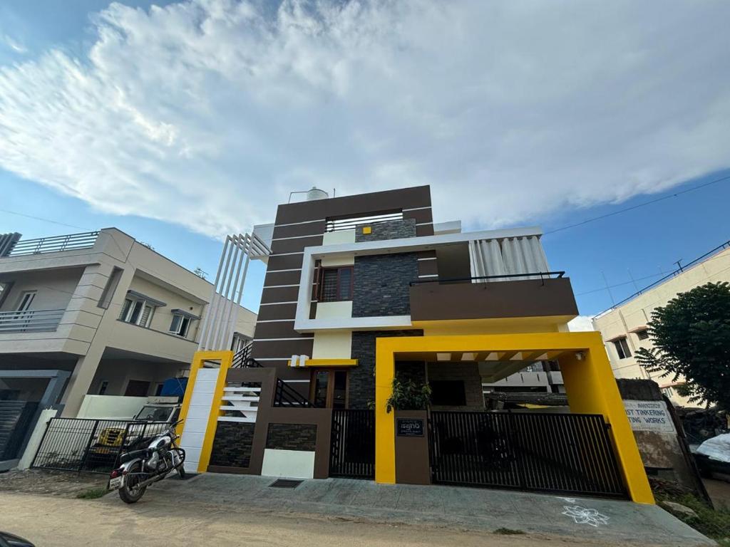 a building with a motorcycle parked in front of it at Sapthagiri Euphoria in Chikmagalūr