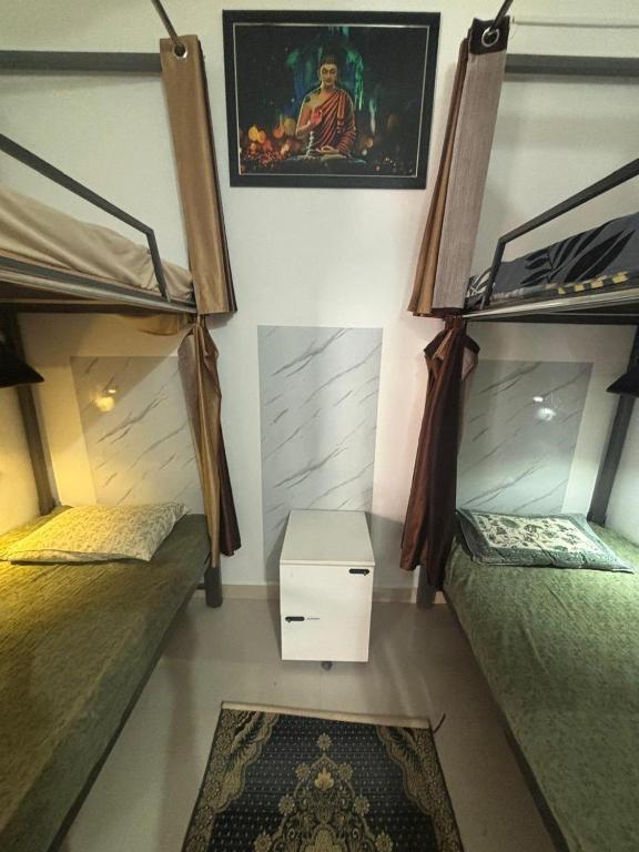a room with two bunk beds and a rug at Sapthagiri Euphoria in Chikmagalūr