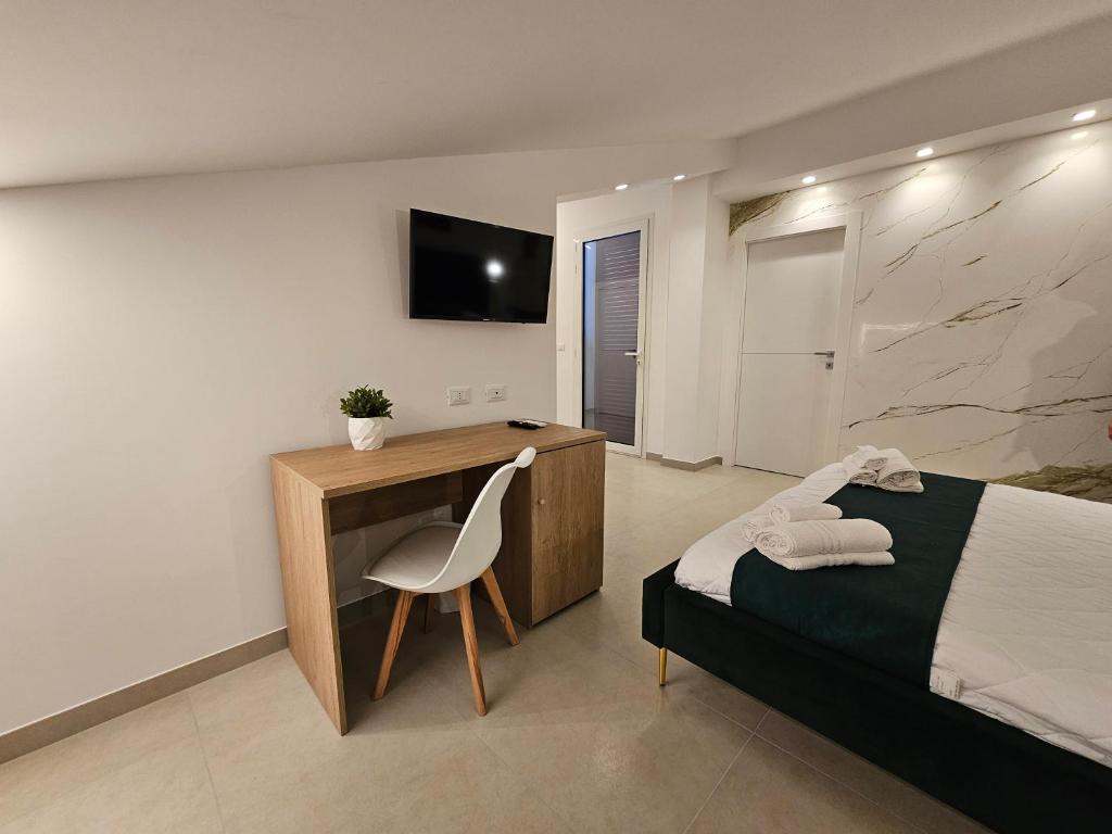 TV a/nebo společenská místnost v ubytování Aura B&B