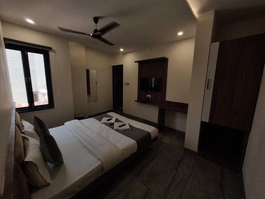 Postel nebo postele na pokoji v ubytování Hotel PRAKASHAM
