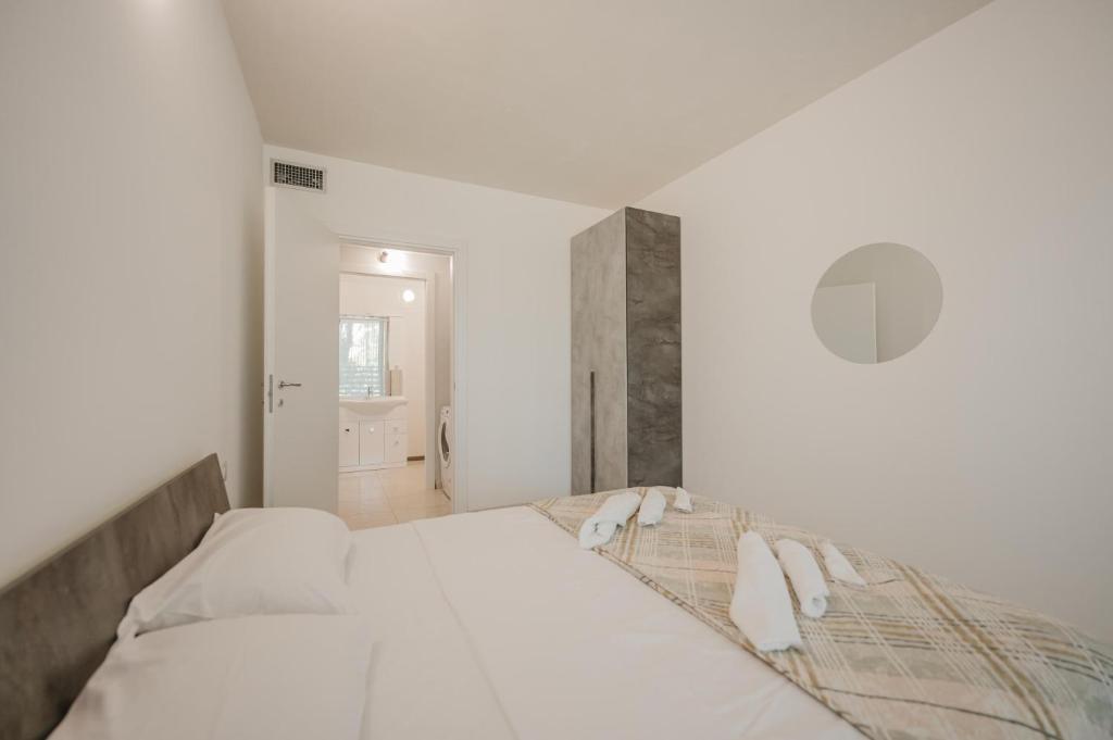 Postel nebo postele na pokoji v ubytování Appartamento Residence Mimose