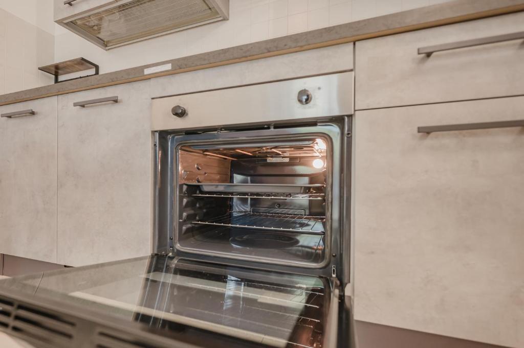 Kuchyň nebo kuchyňský kout v ubytování Appartamento Residence Mimose