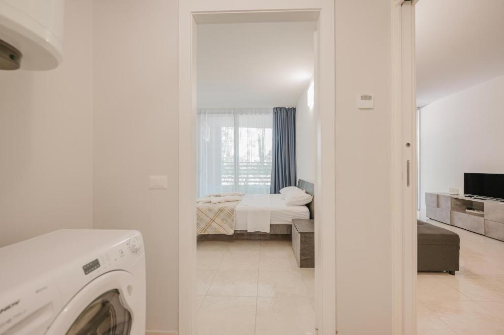 Postel nebo postele na pokoji v ubytování Appartamento Residence Mimose