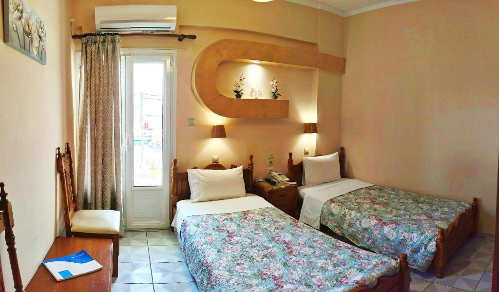 Postel nebo postele na pokoji v ubytování Hotel Anagennisis