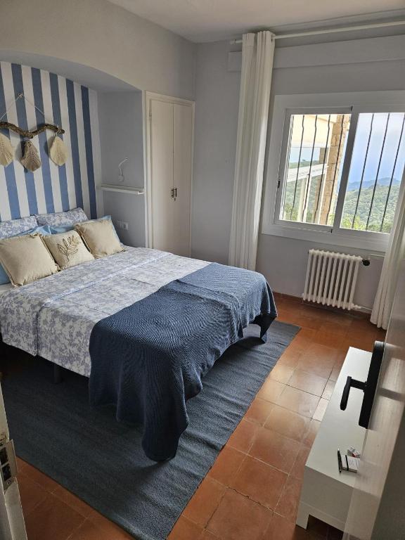 Postel nebo postele na pokoji v ubytování La Roqueta Hotel