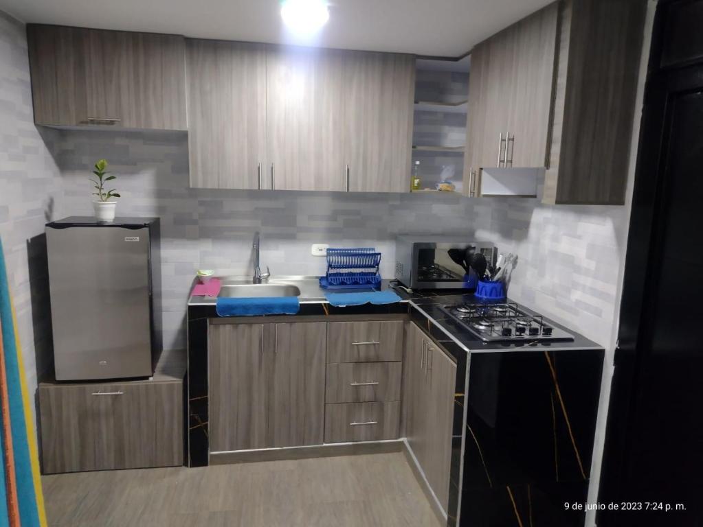 Η κουζίνα ή μικρή κουζίνα στο Apartamento vacacional con parqueadero y piscina