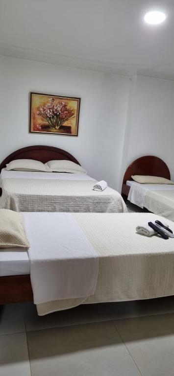 Ένα ή περισσότερα κρεβάτια σε δωμάτιο στο Hotel Makai SAS