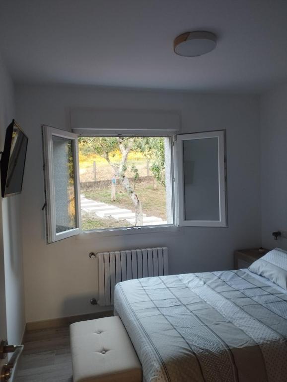 Postel nebo postele na pokoji v ubytování A casa do avó