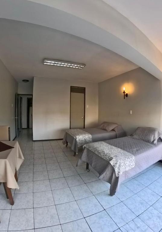 Postel nebo postele na pokoji v ubytování Hotel Qamiri