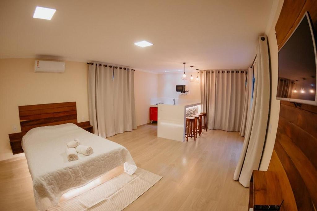 Ένα ή περισσότερα κρεβάτια σε δωμάτιο στο Chalé Montana Pedra Azul