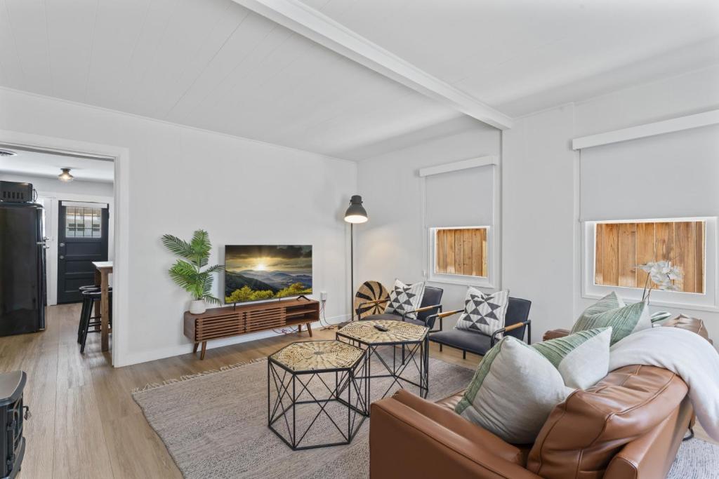a living room with a couch and a table at Balboa Island Cottage Air Conditioning Newport Peninsula Ferry Close in Newport Beach