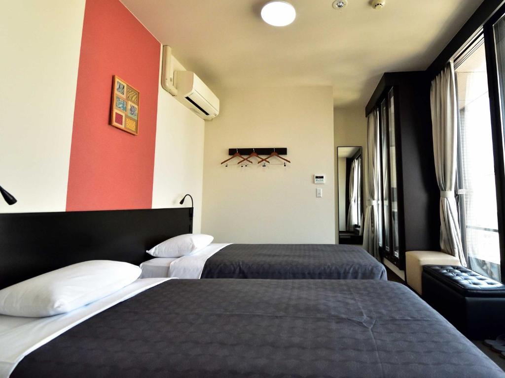 Postel nebo postele na pokoji v ubytování Izutsu Hotel Kyoto Kawaramachi Sanjo