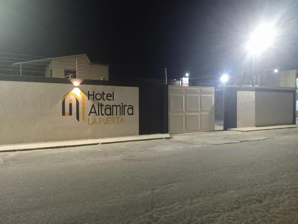 a hotel atlanta sign on a wall at night at Hotel Altamira La Puerta in Punta Cardón