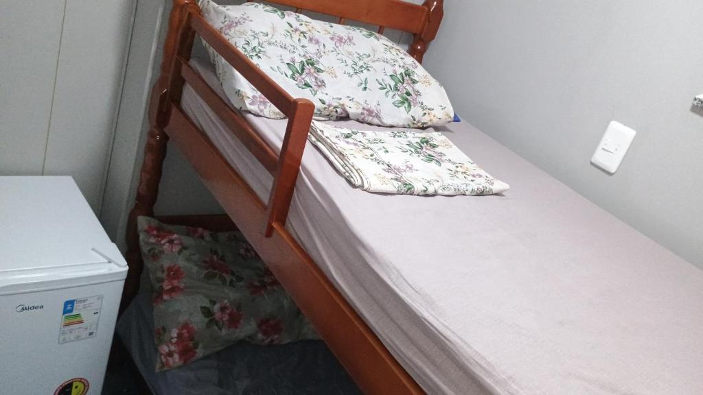 a bunk bed with two pillows on top of it at Hospedagem Cinelândia AP 617 in Rio de Janeiro