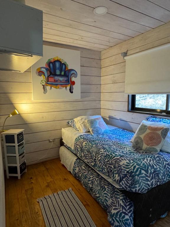Postel nebo postele na pokoji v ubytování Cabaña del Bosque
