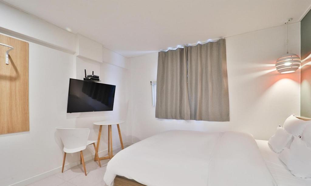 TV a/nebo společenská místnost v ubytování Haeundae Dongbeck Hotel