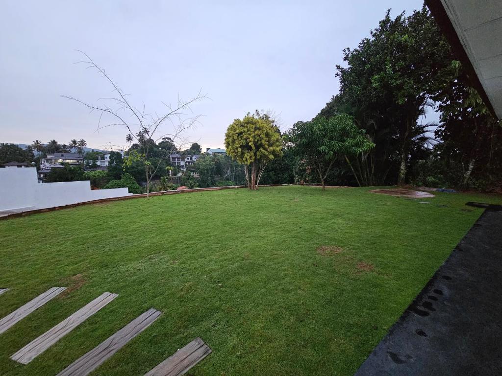 Zahrada ubytování Alpha Bungalow - Kandy