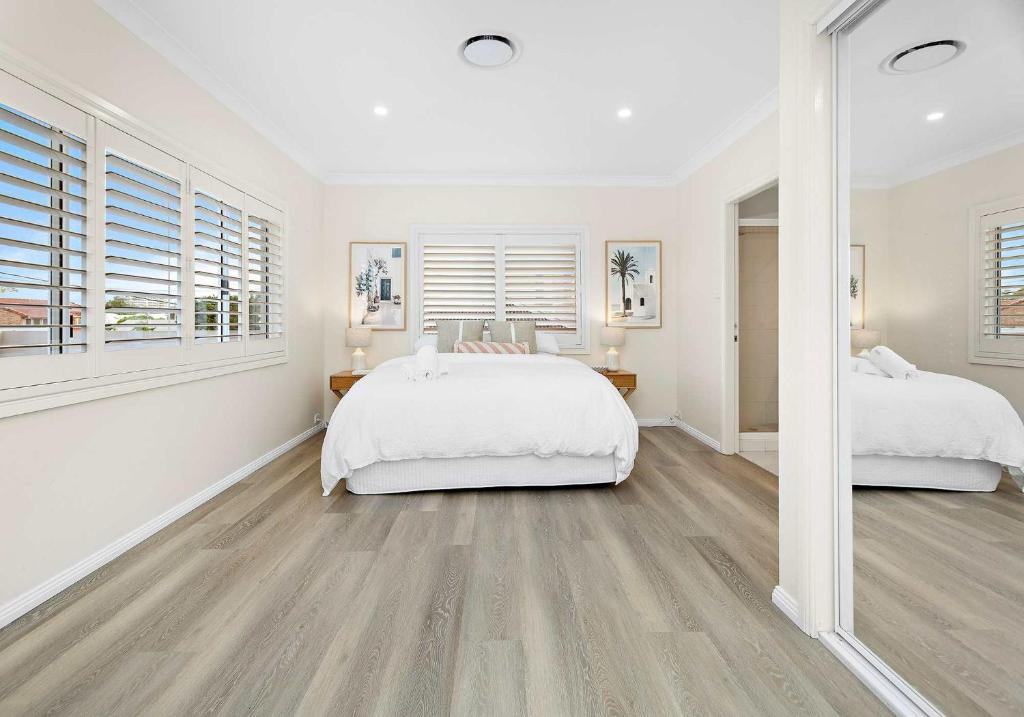 Postel nebo postele na pokoji v ubytování Shellharbour Poolside Escape