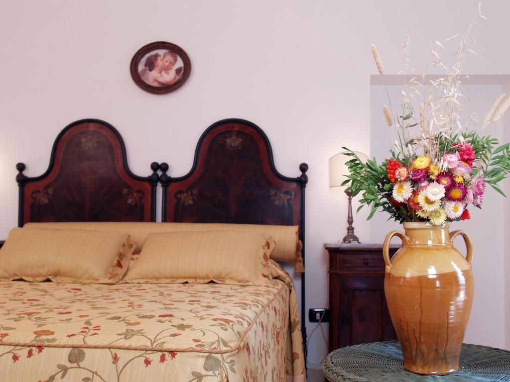 Postel nebo postele na pokoji v ubytování Hotel Masseria Tutosa