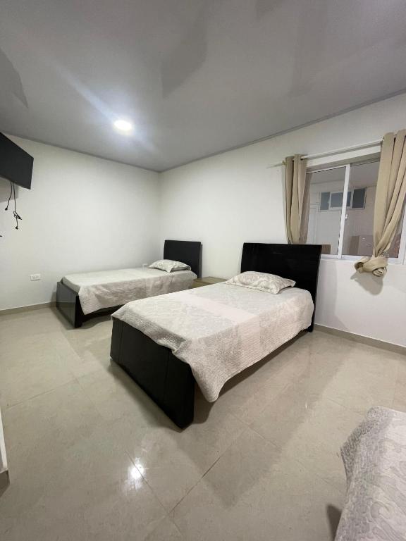 Postel nebo postele na pokoji v ubytování Posada Three Cay Suites