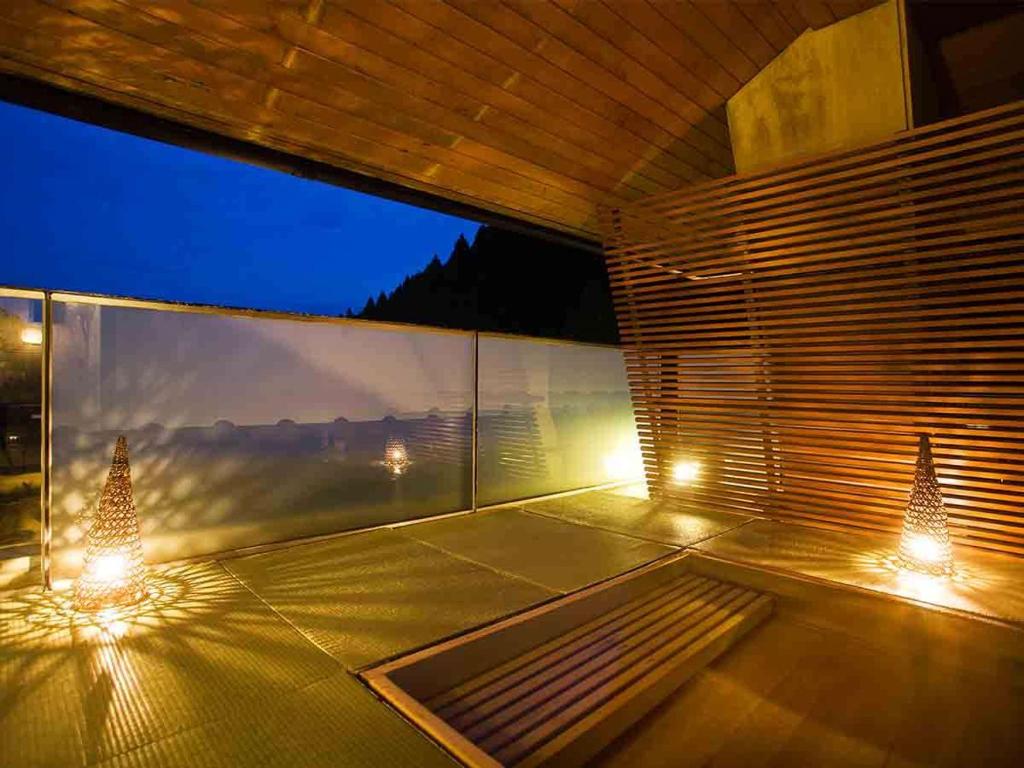 a room with lights on the floor of a building at kanazawayuwakuonsen nihonryourisakaeya in Kanazawa