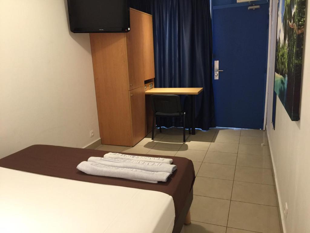 Postel nebo postele na pokoji v ubytování Karaibes Hotel