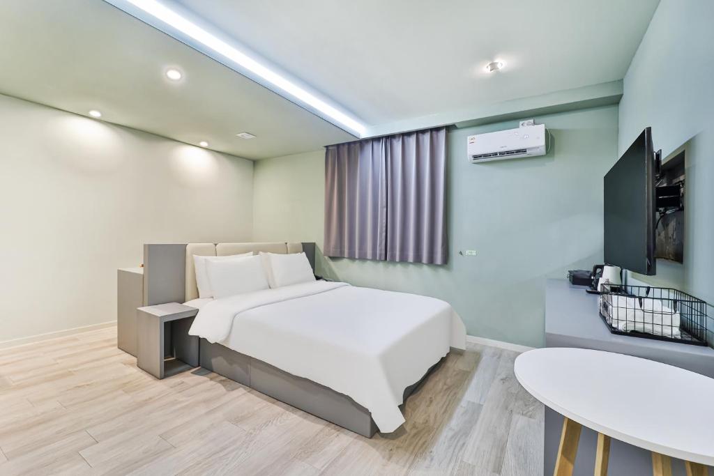 Postel nebo postele na pokoji v ubytování Sloth Hotel Busan Seomyeon