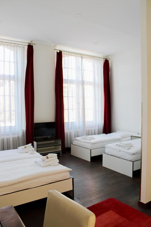 Postel nebo postele na pokoji v ubytování GLS Studio Hotel Berlin